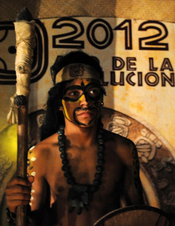 A[-]Maya[-]Chorti[-]stands[-]guard[-]during[-]the[-]ball[-]game[-]between[-]Honduras'[-]Maya[-]Chorti[-]and[-]Guatemala´s[-]Quirigua[-]in[-]Copan[-]Ruinas,[-]some[-]400[-]kms[-]west[-]of[-]Tegucigalpa,[-]on[-]December[-]18,[-]2012.